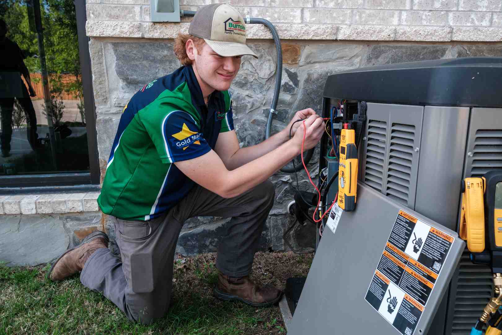 Professional HVAC technician inspecting a heating and cooling system in Frisco Texas Professional HVAC technician inspecting a heating and cooling system in Frisco Texas
