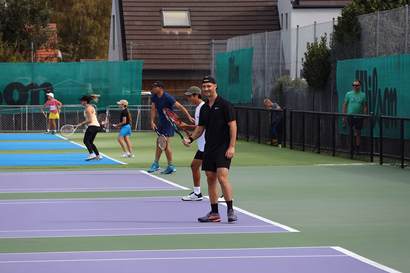 Tennis players on the courts during Saturday afternoon social play