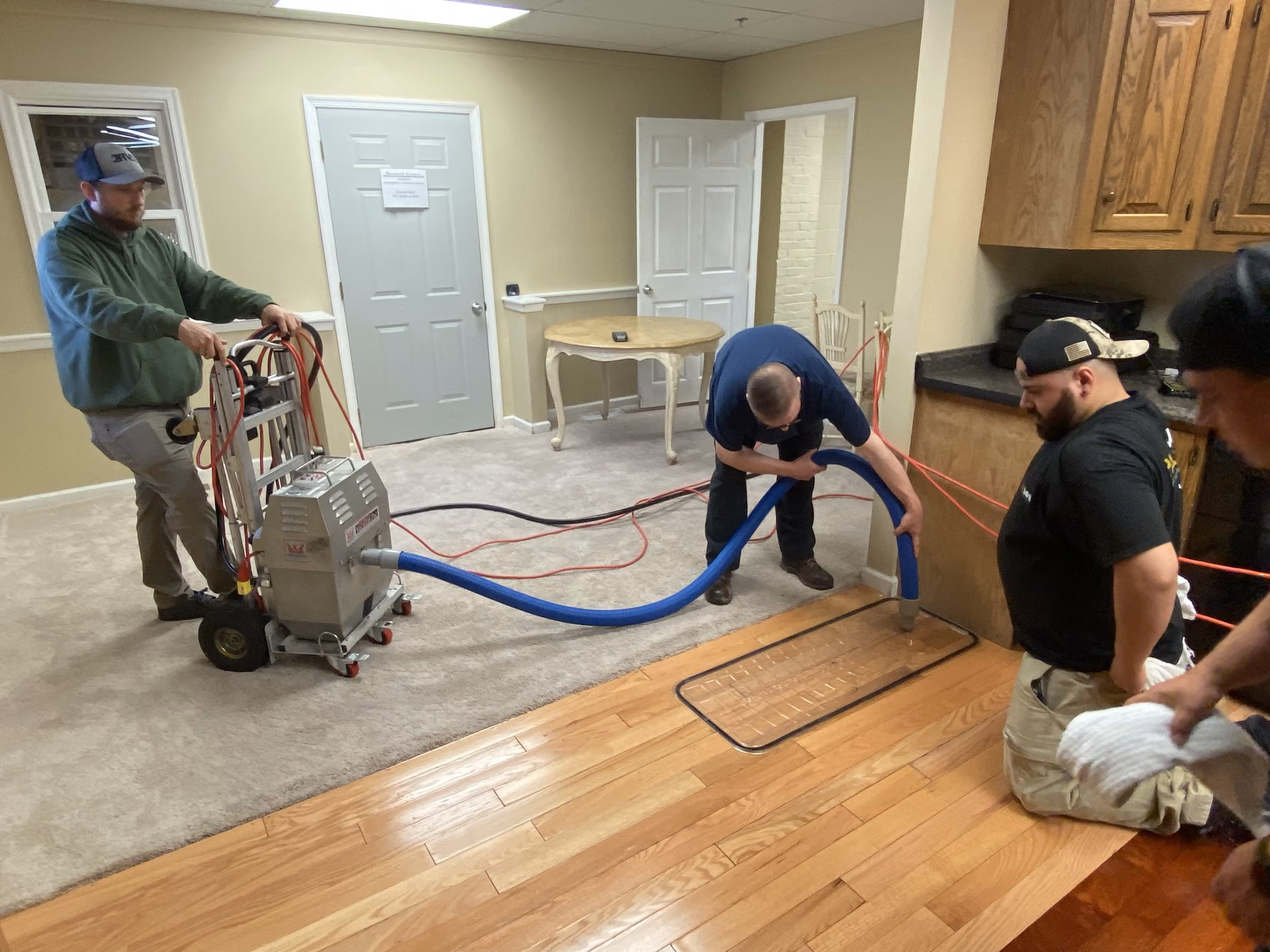 IICRC class working a live water loss in the RTI flood house.