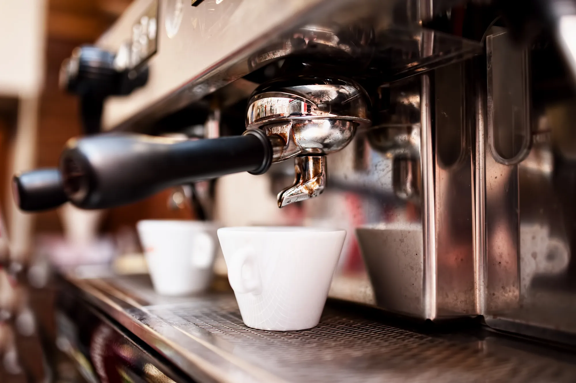 Coffee espresso machine serving a cup