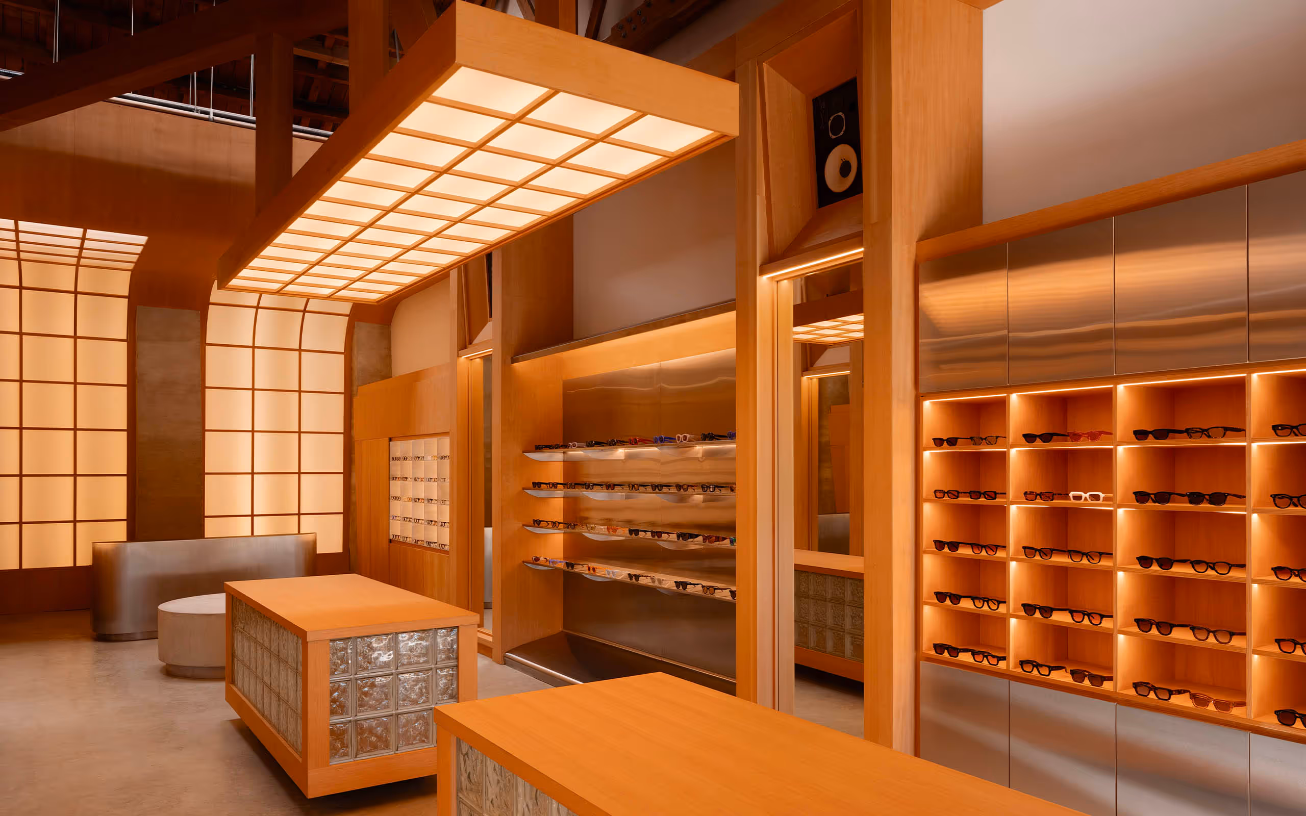 Inside store with wooden shelving filled with sunlasses