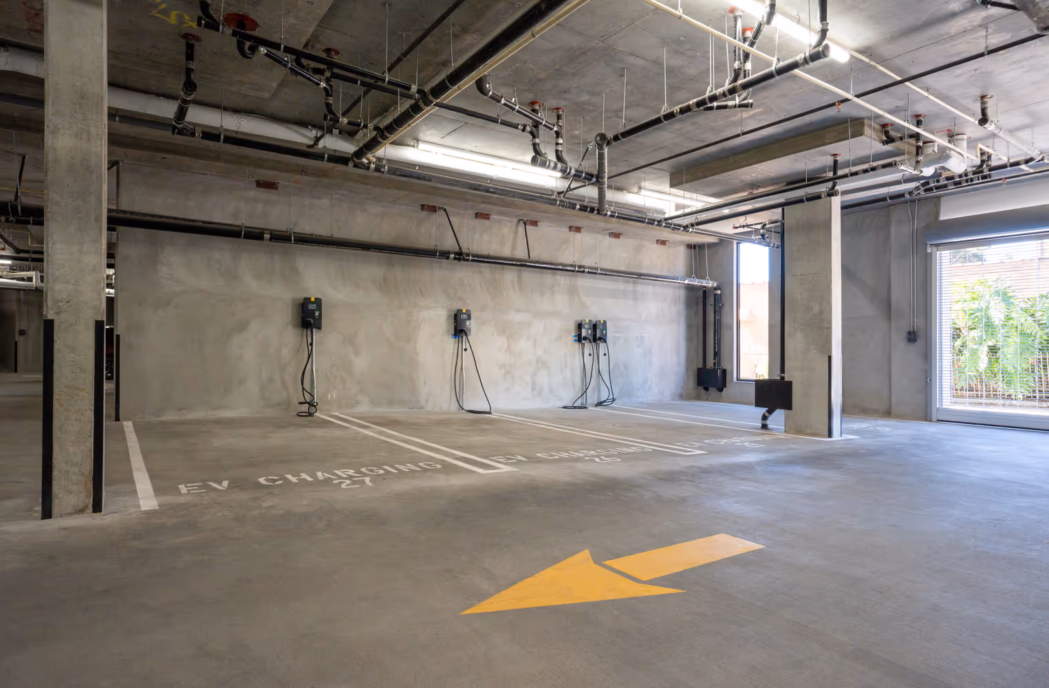 Interior parking garage with EV charging parking stalls
