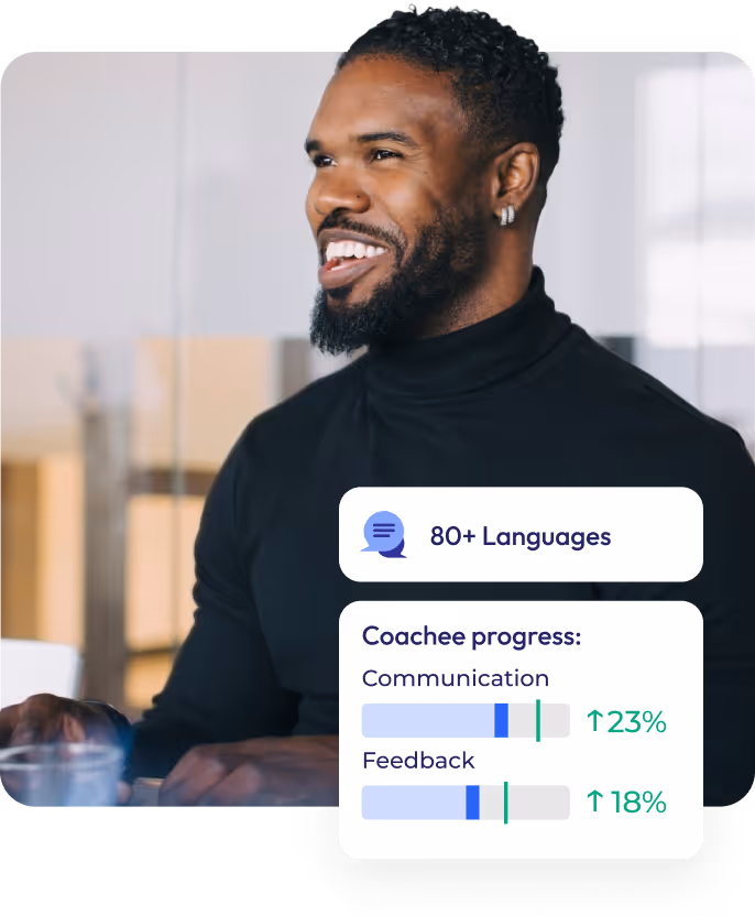 Young man wearing black sweater is smiling during work. Image is decorated with modern UI elements.