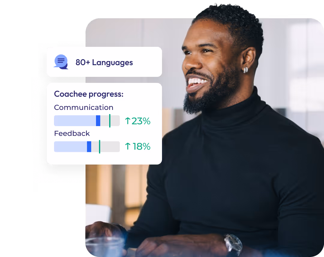 Young man wearing black sweater is smiling during work. Image is decorated with modern UI elements.