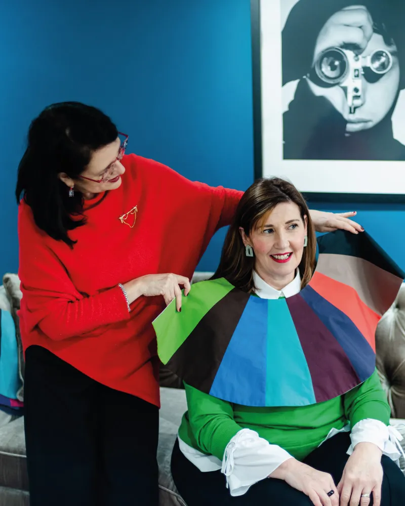 Lisa and Marie using colour swatches in shop