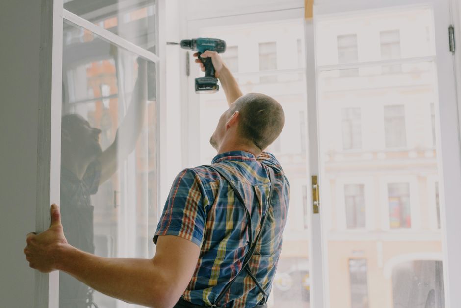 professional window installers at work on a New Jersey home