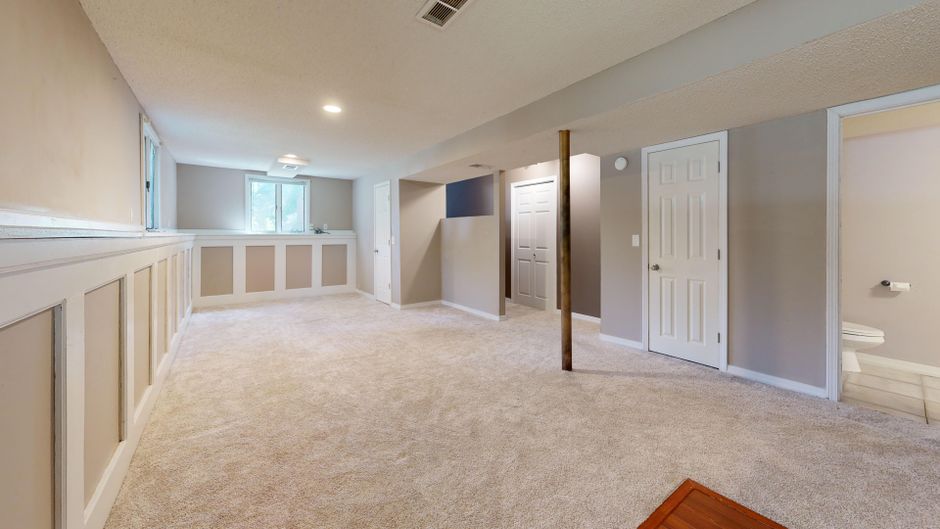 a dry and insulated basement living room with modern lighting a dry and insulated basement living room with modern lighting