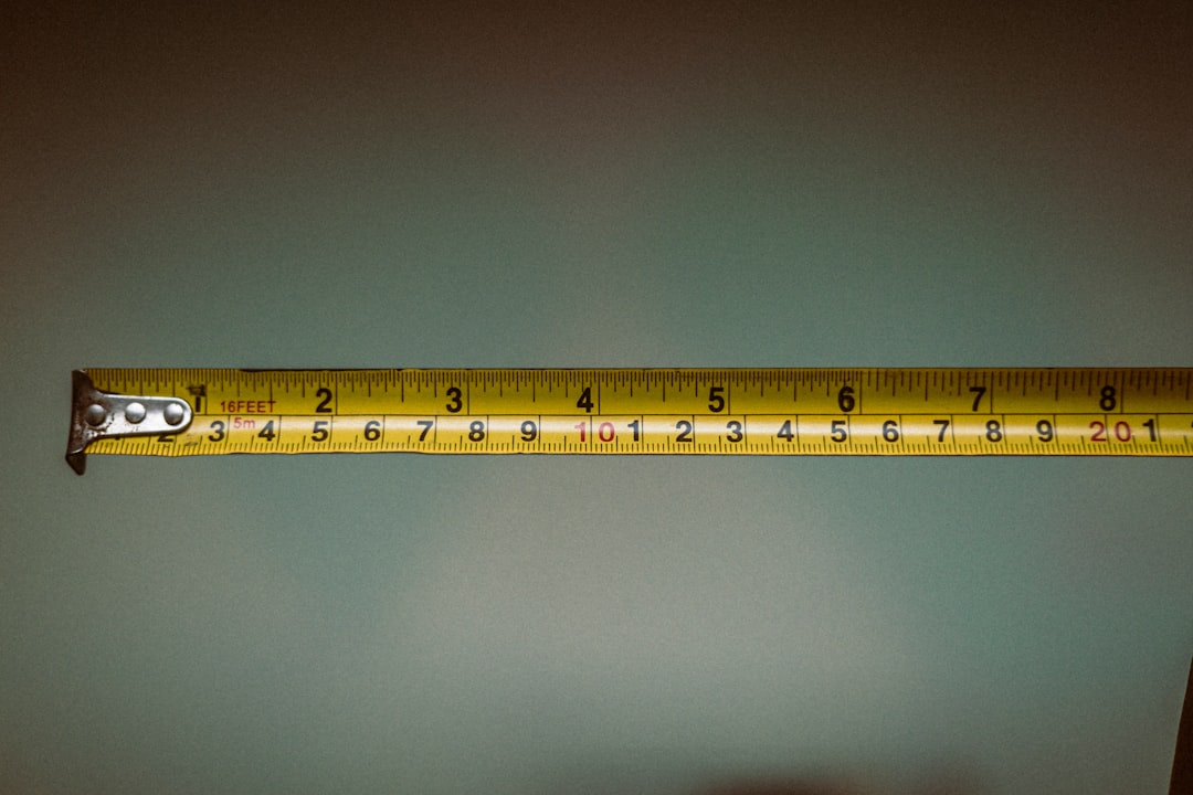 Measuring a window frame opening with a tape measure Measuring a window frame opening with a tape measure