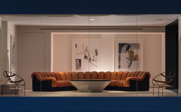 Lounge with modular sofa and glass coffee table inside Spring Studios.