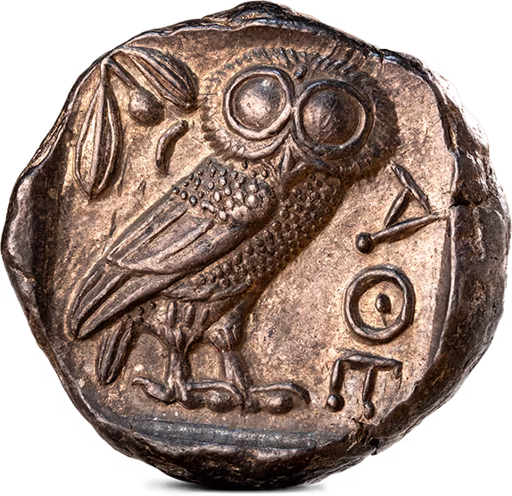 Oud-Griekse munt met een afbeelding van een uil, een olijftak en het opschrift “ΑΘΕ” 