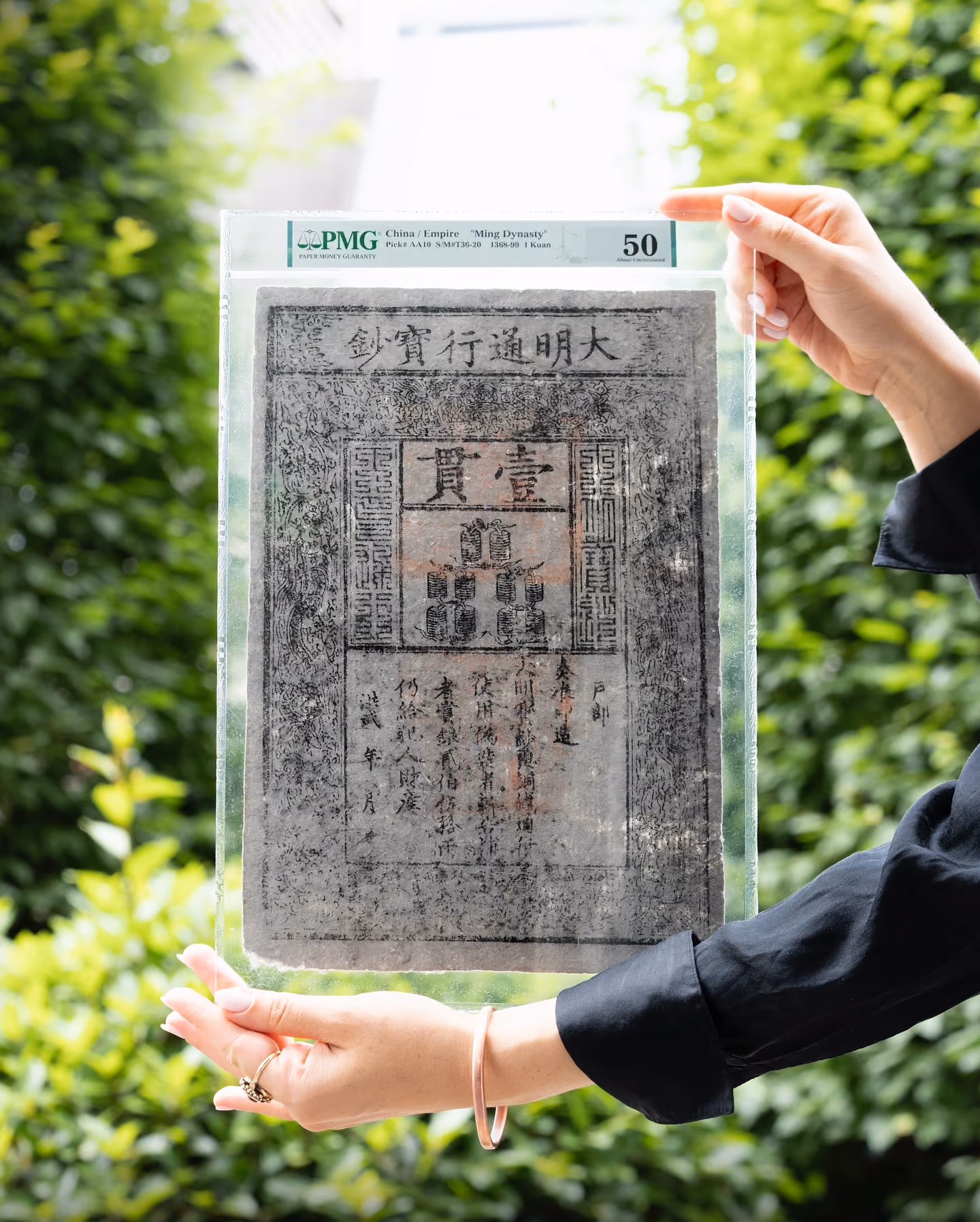 Ming Dynasty 1 kuan banknote from 1368-1399 in PMG holder, About Uncirculated 50