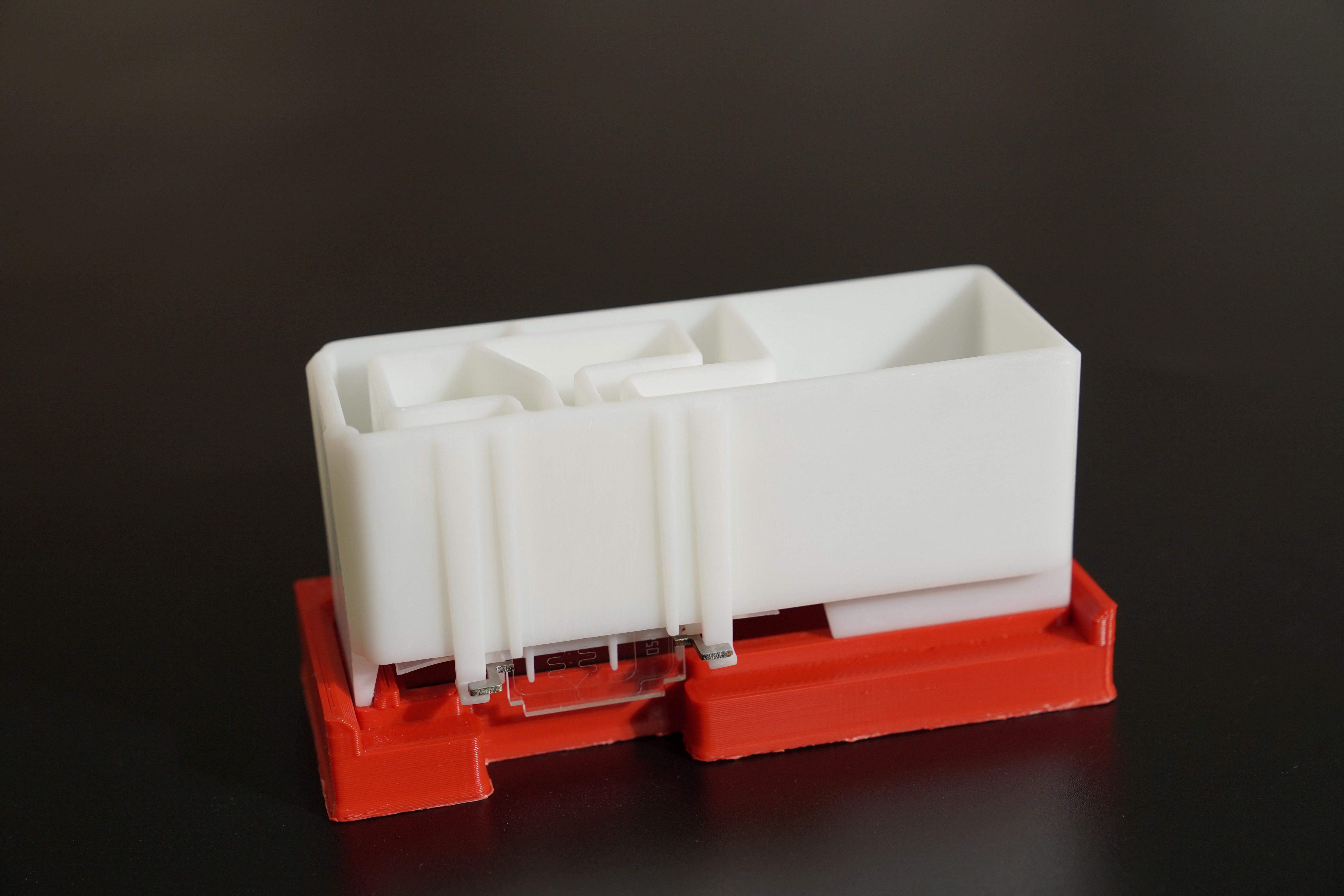 Microfluidic chip attached edge-wise to the cartridge