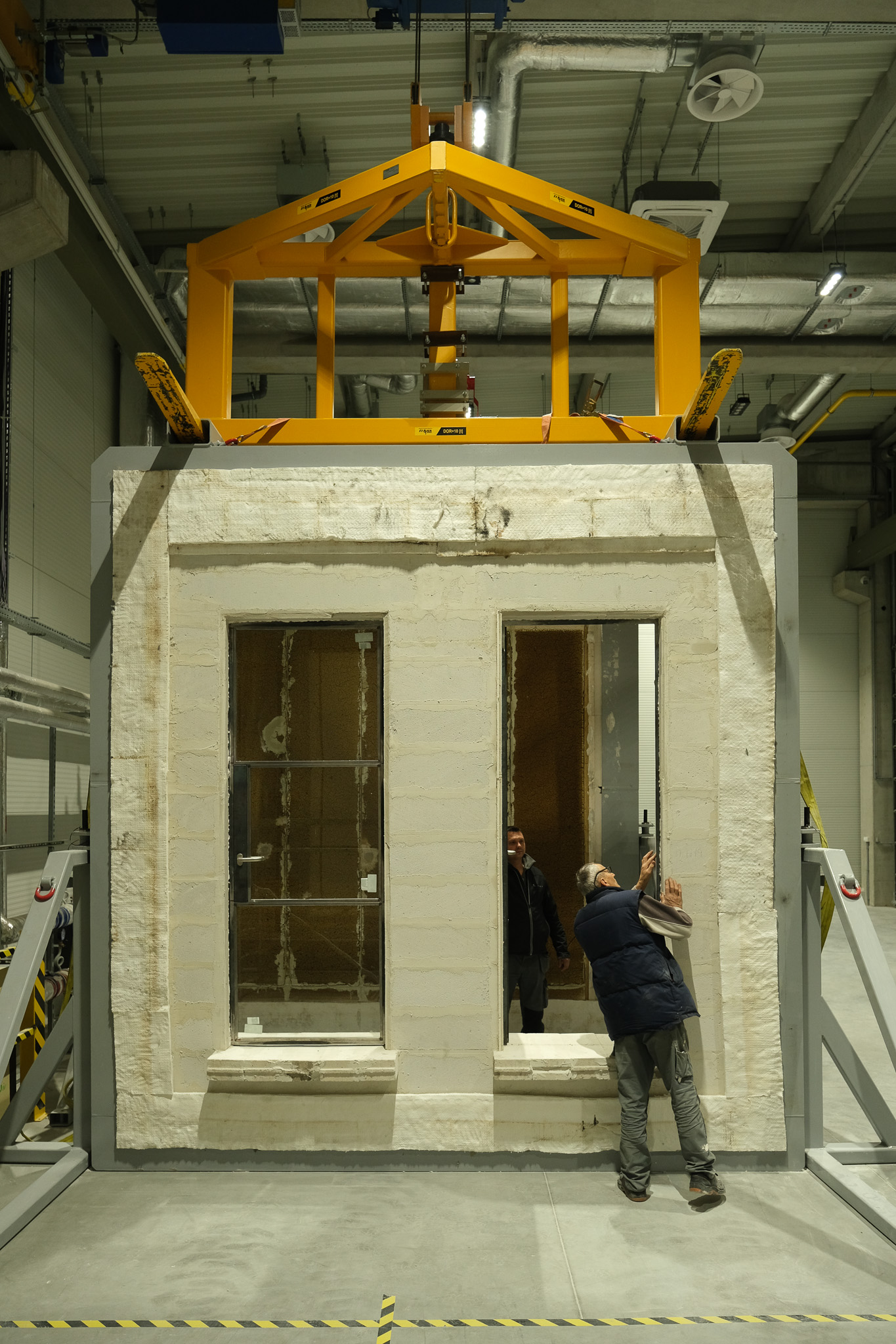 Two glazed steel doors fitted in a furnace wall at a fire test laboratory