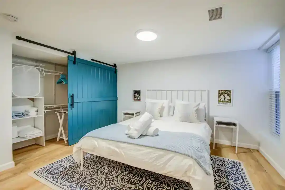 a bedroom with a bed and a bookcase