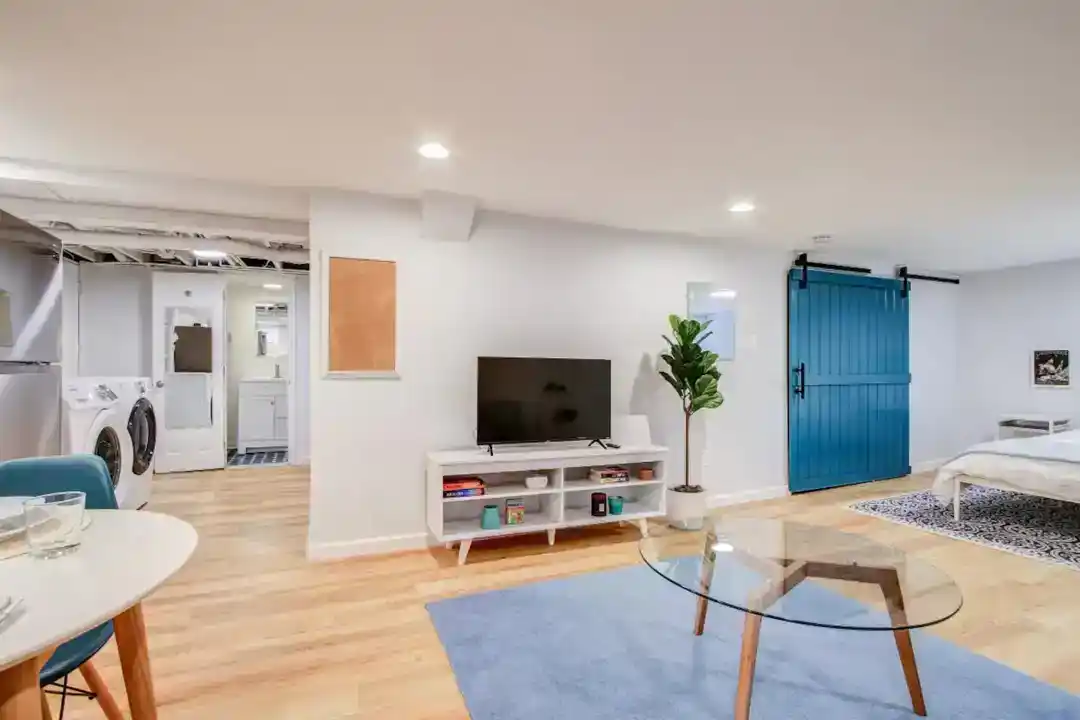 a living room with a TV and a table