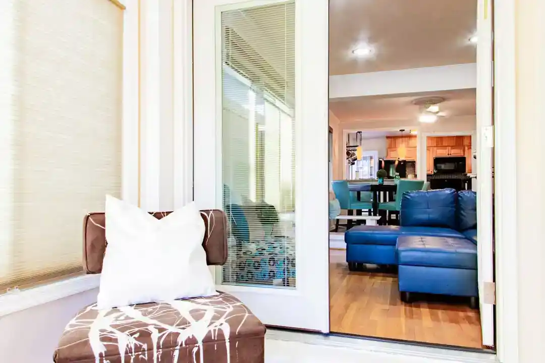 A cozy living room in a townhouse accommodation in Washington DC with a fireplace and a couch