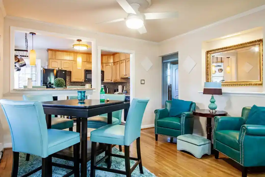 An elegant townhouse for rent in Washington DC with a kitchen furnished with a black refrigerator