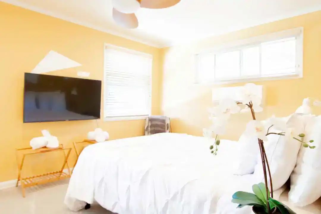 A modern townhouse in Washington DC with a bathroom featuring a toilet, sink, and mirror
