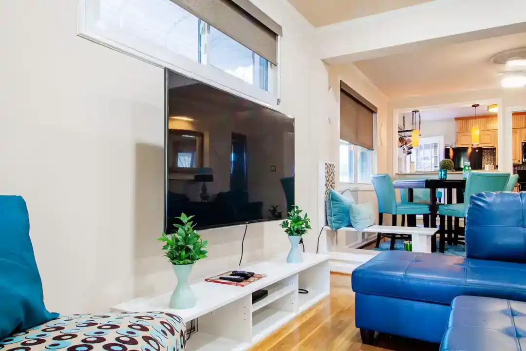 A modern townhouse in Washington DC with a bathroom including a sink and a shower curtain