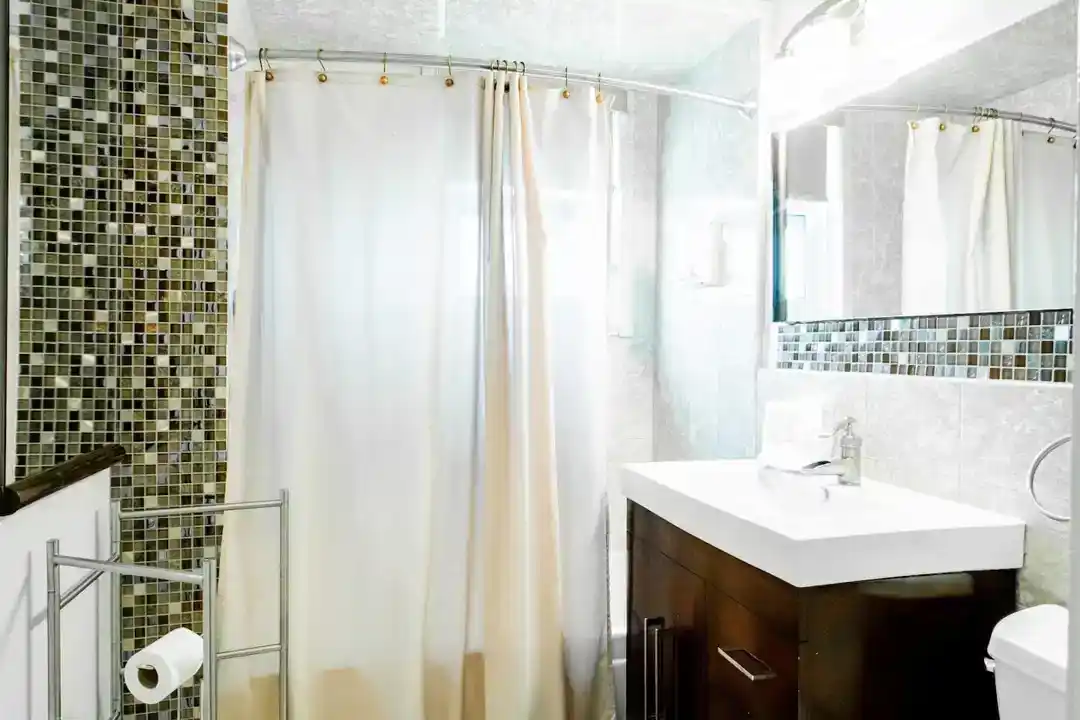 A tastefully decorated townhouse for rent in Washington DC with a bedroom furnished with two beds