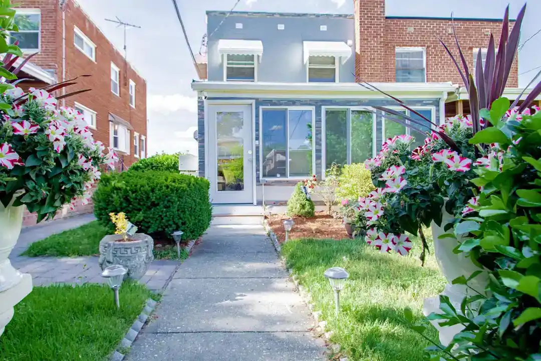 An elegant townhouse rental in Washington DC with a cozy living room featuring a fireplace