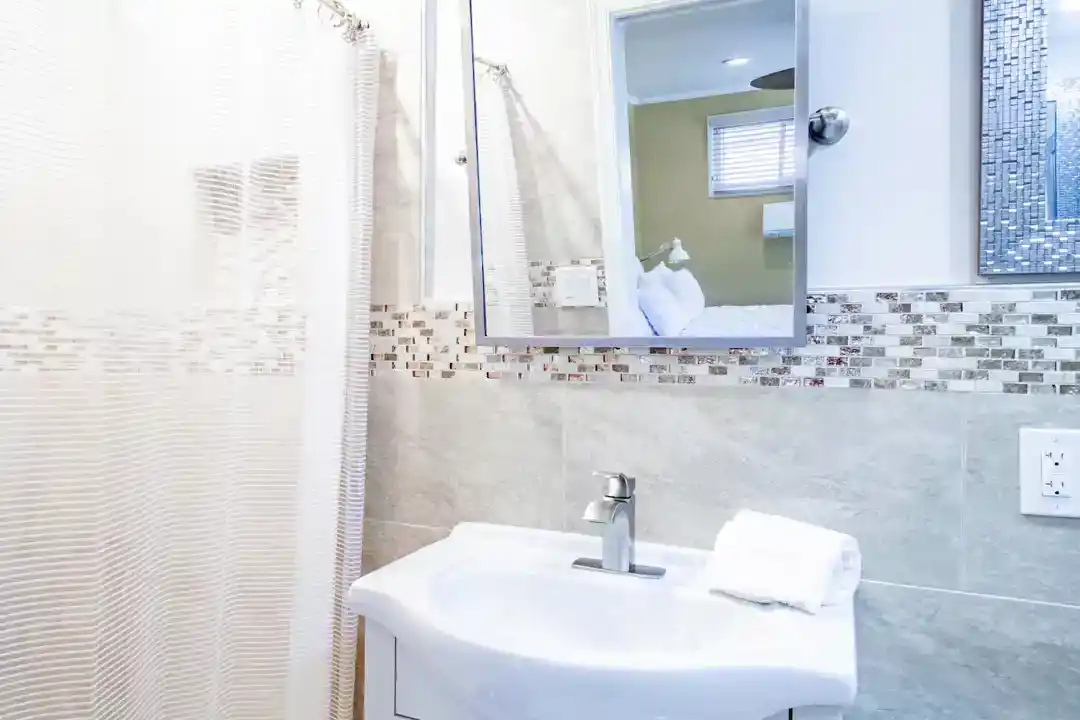 An attractive townhouse accommodation in Washington DC with a white refrigerator and stove in the kitchen