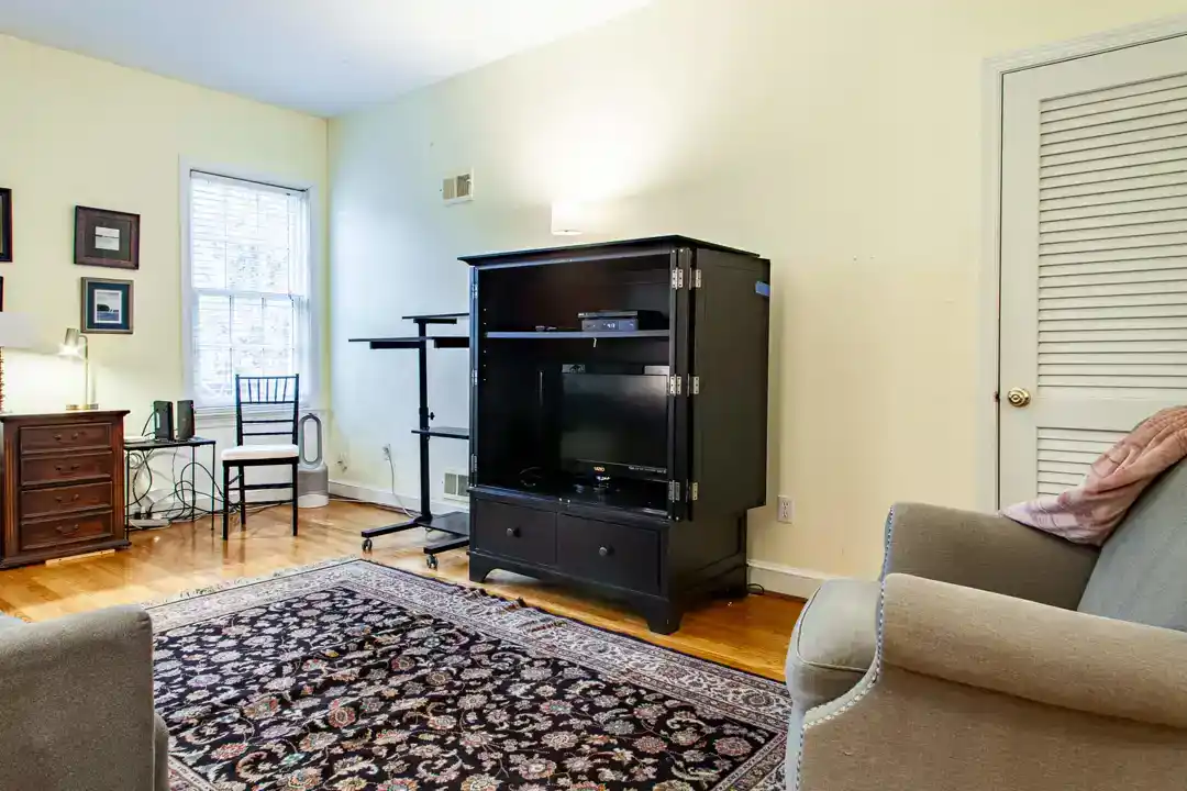 a spacious living room with a fireplace