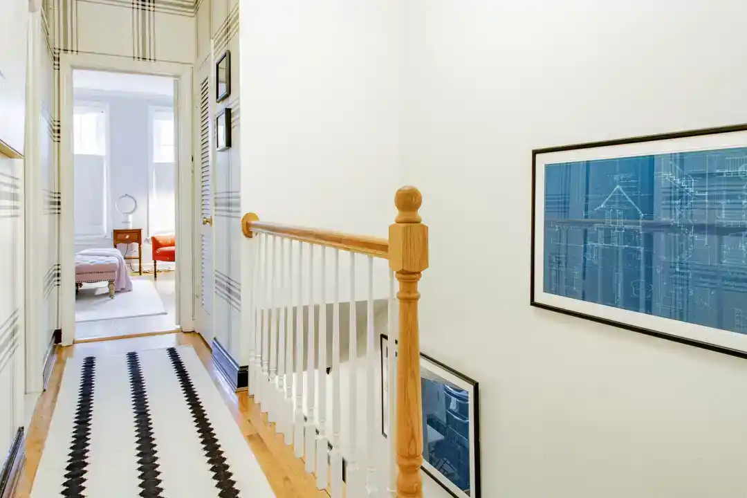 a luxurious hallway with a black rug and a black rug on the floor