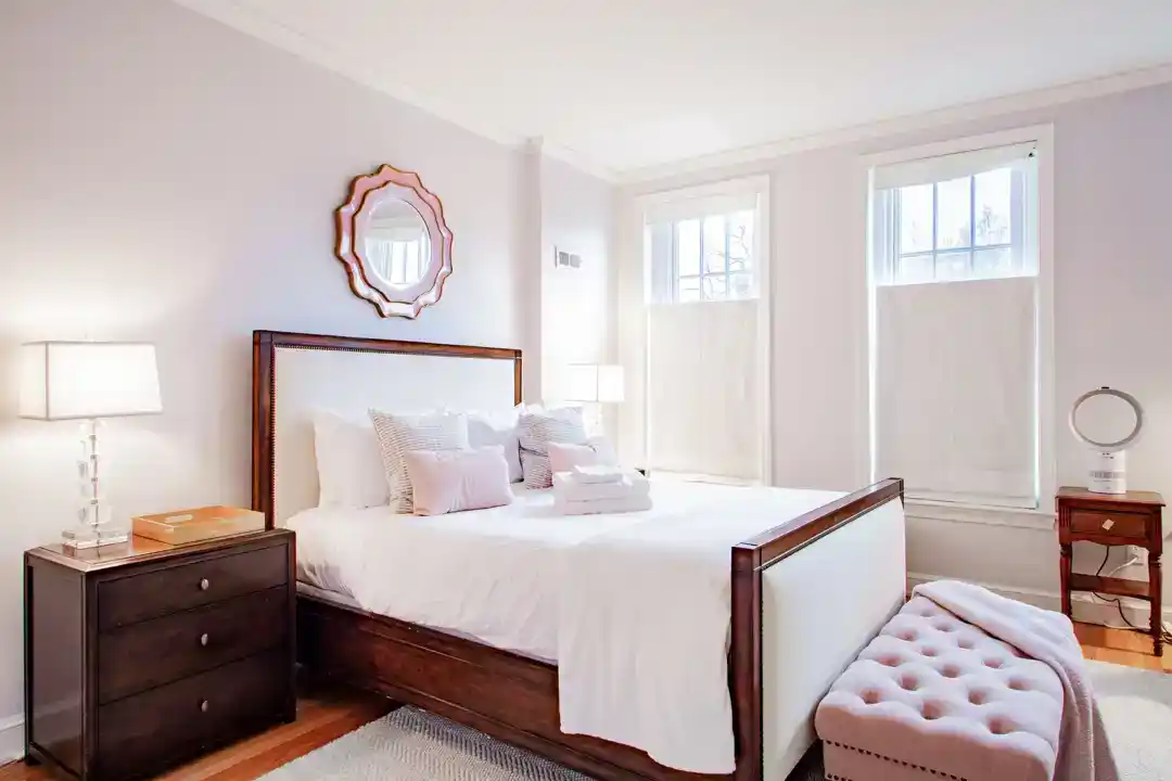 a charming bedroom with two beds