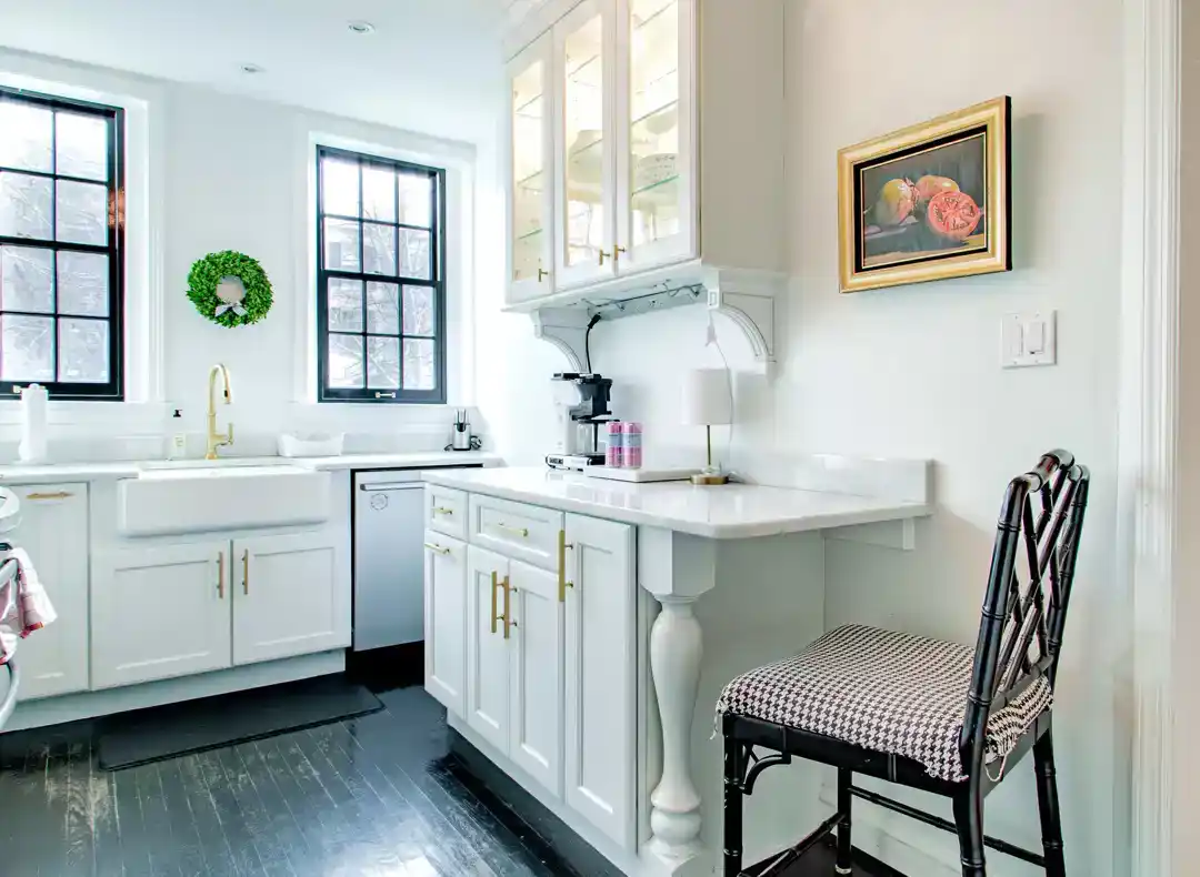 a stylish kitchen with a chair and a sink
