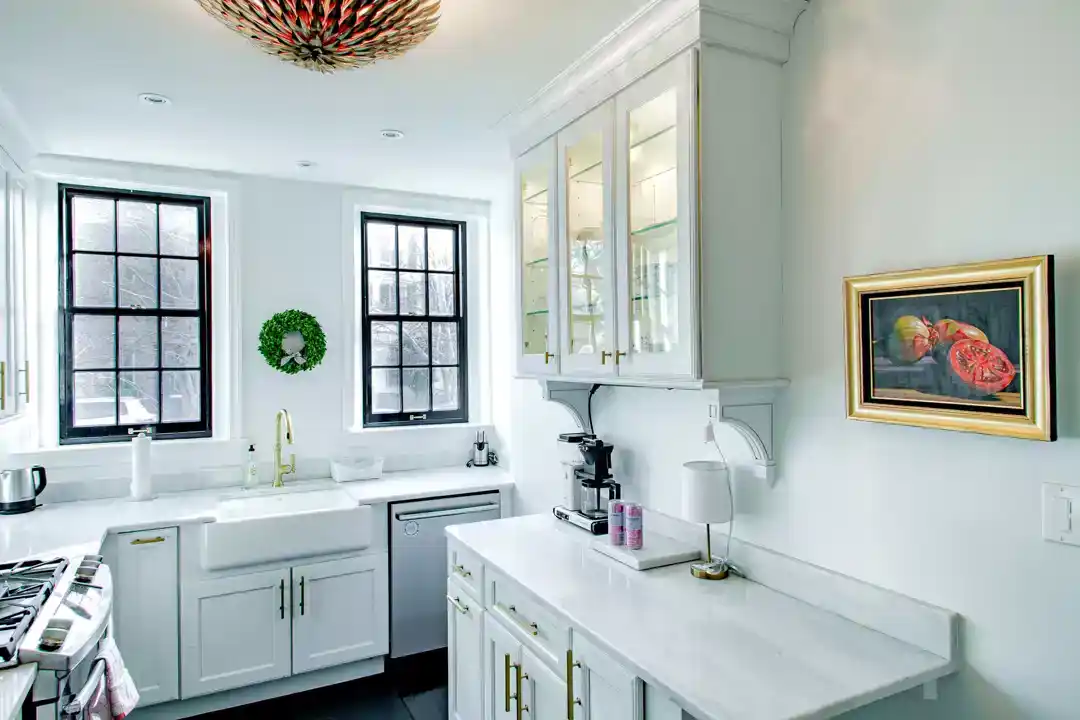 a spacious kitchen with white cabinets