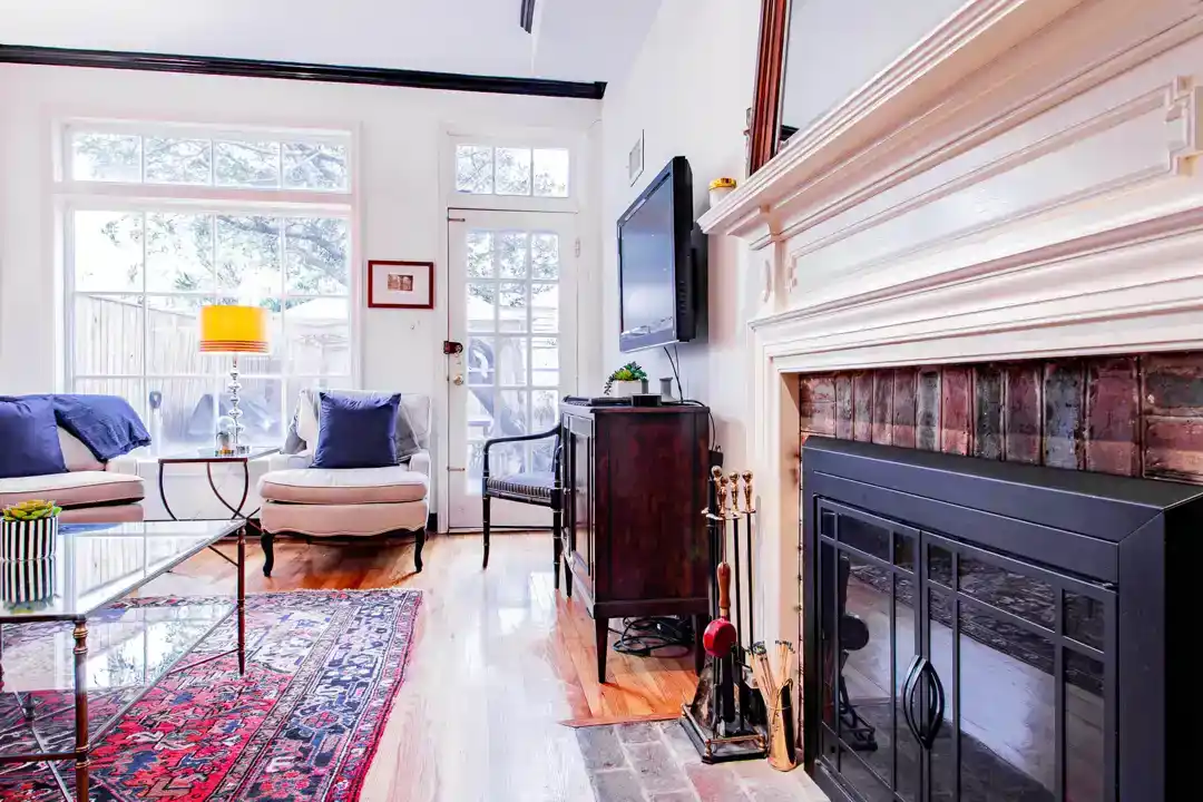 a cozy living room with a fireplace