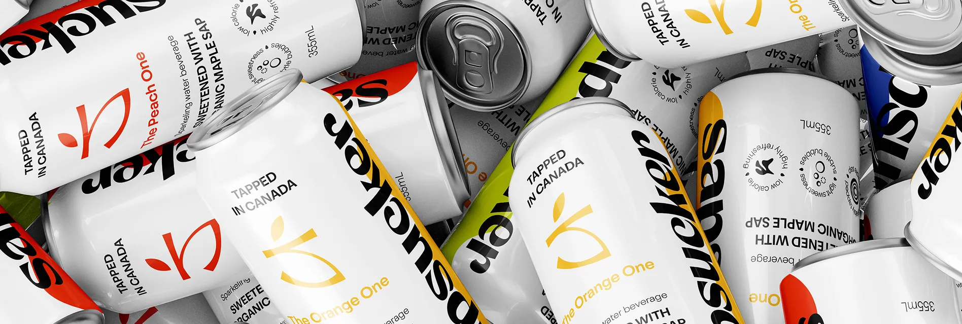 A pile of Sapsucker sparkling water cans with bold typography and colored accents for each flavor.