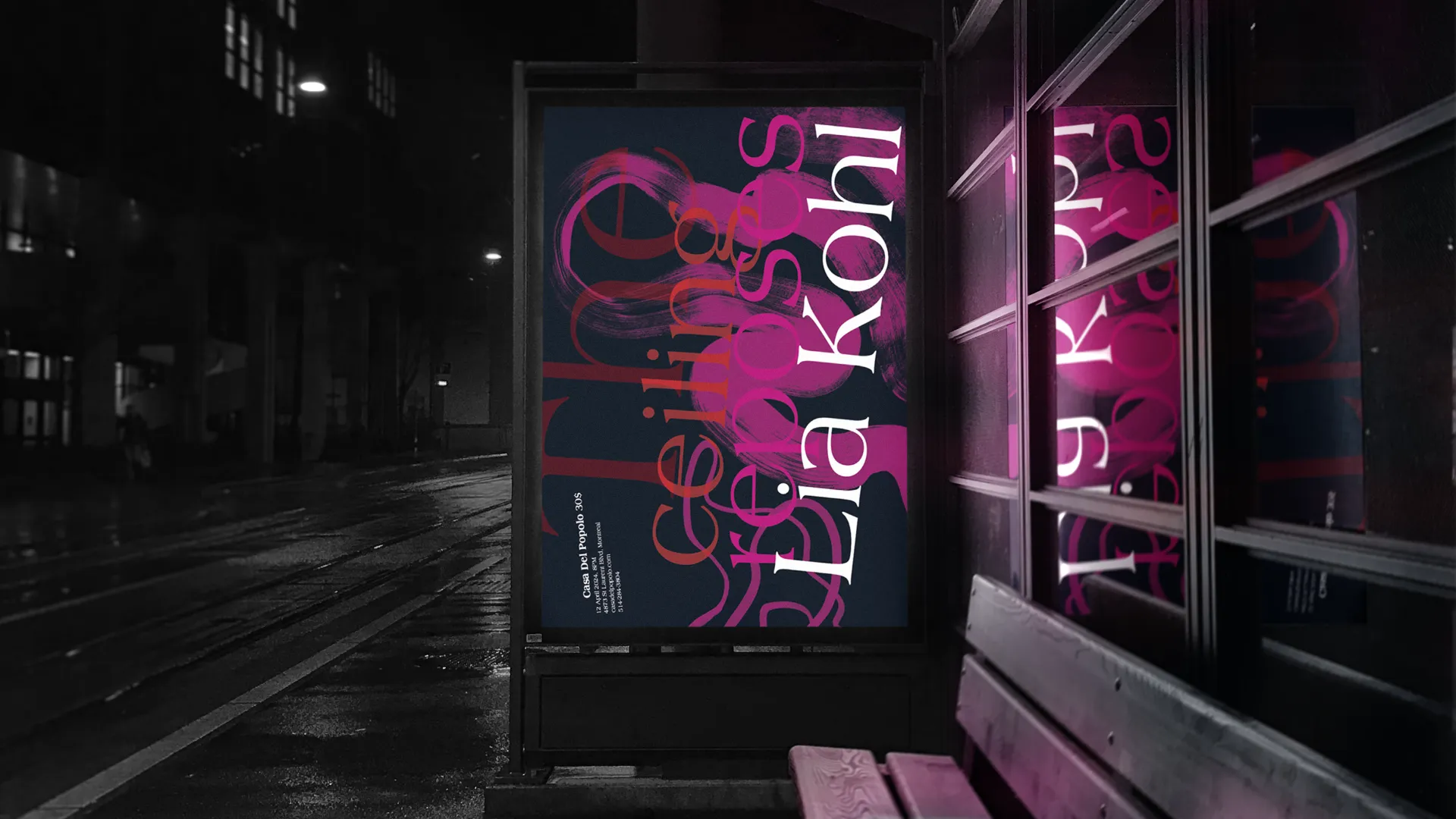 Bus stop advertising the album at night