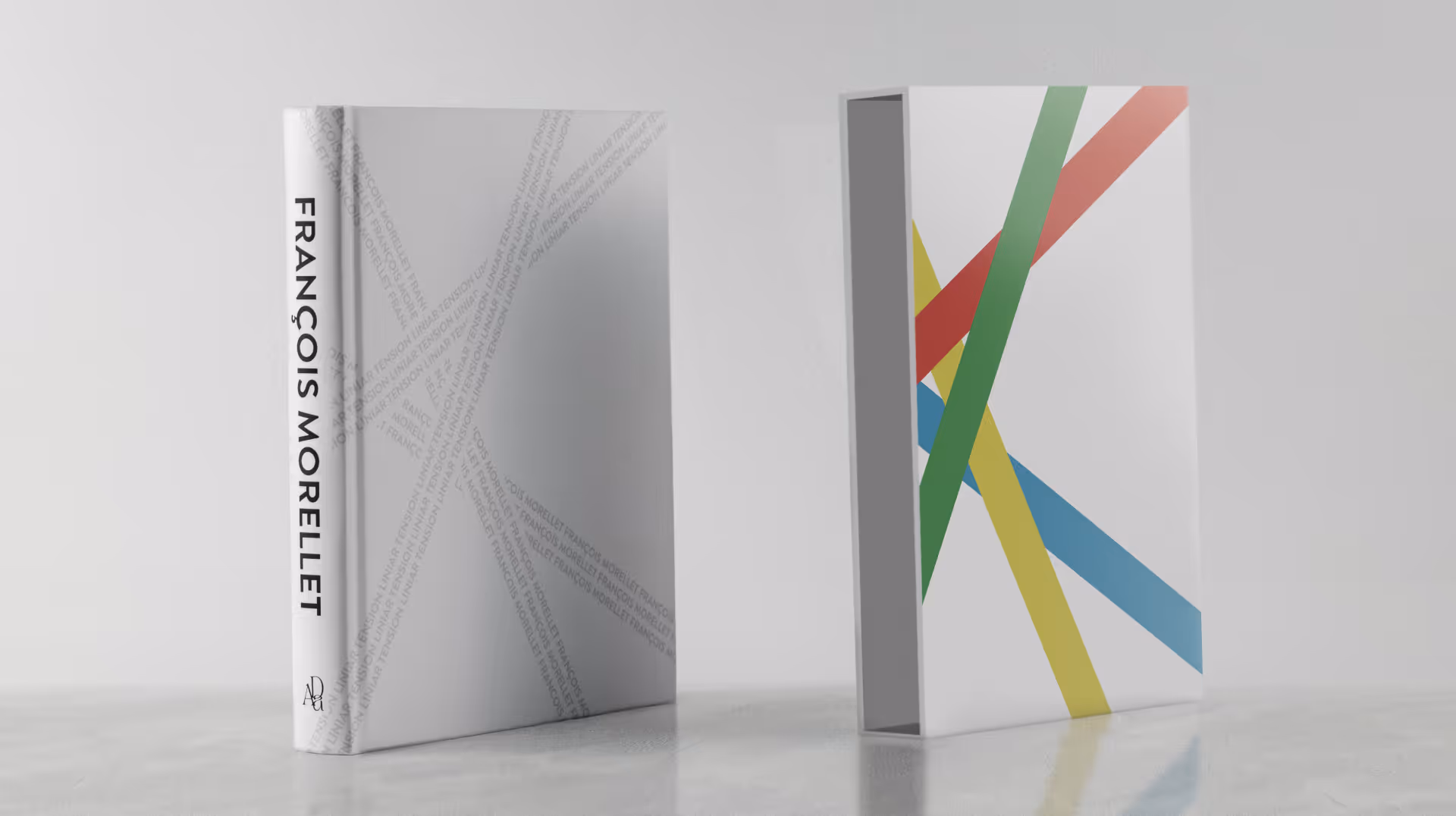 François Morellet book with diagonal typographic design next to a colorful striped slipcase.