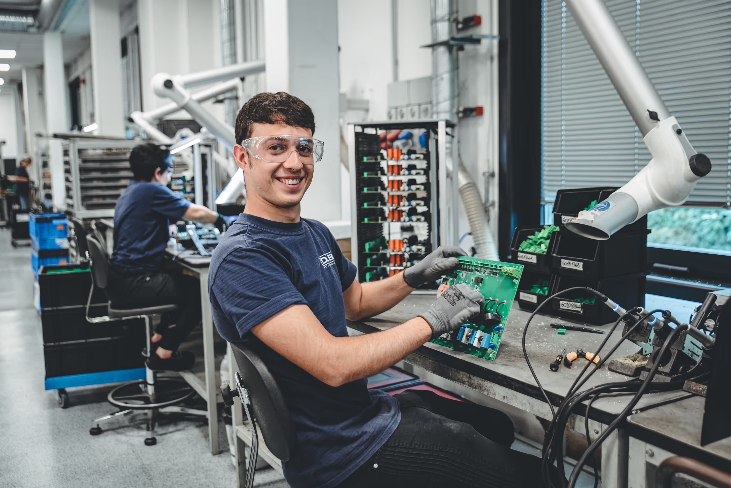 Electronics Workshop Smiling Technician at DAB production area