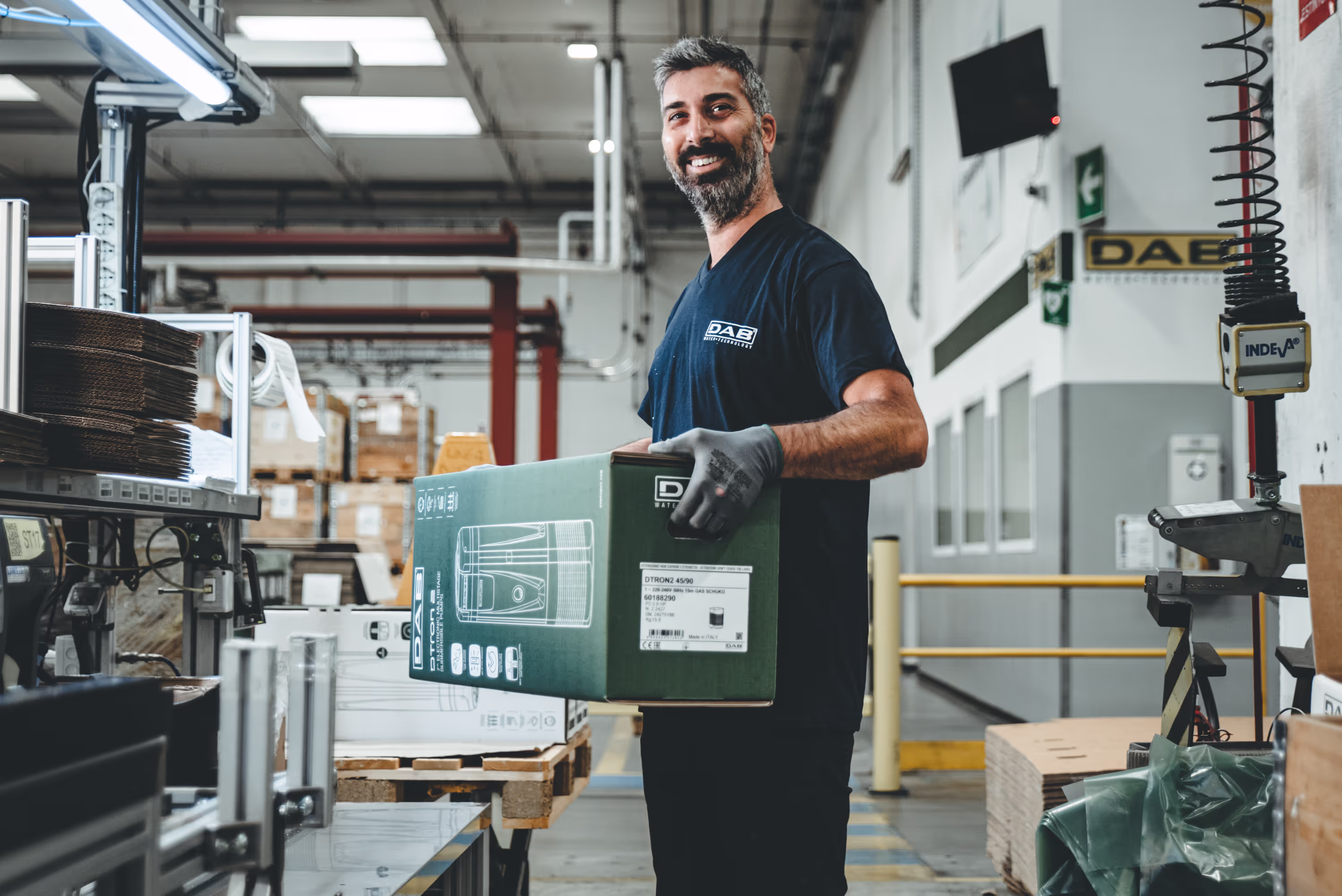 Warehouse Worker holding a Box Smiling