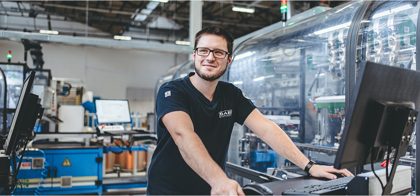Guy smiling in the production department of DAB
