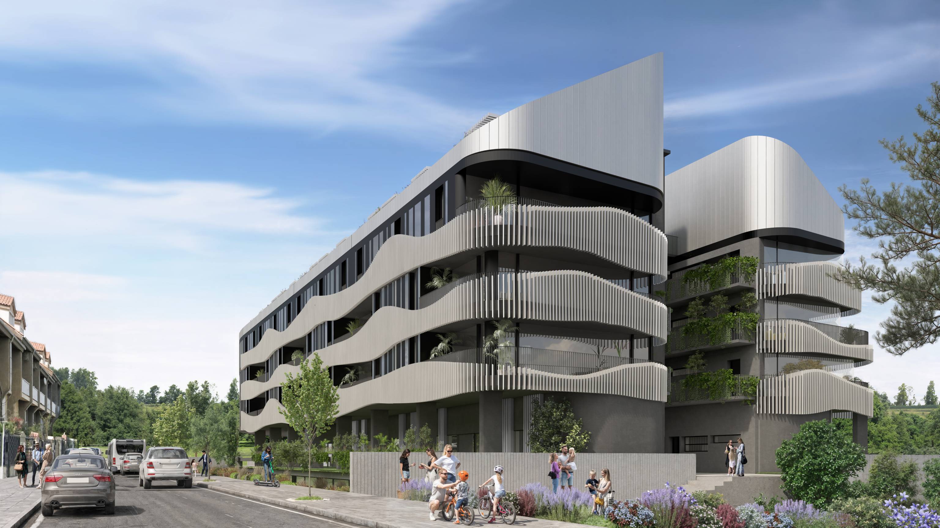 Edificio moderno con fachada de vidrio y estructura metálica diagonal, visto al atardecer. El edificio se encuentra en una avenida arbolada con peatones y coches circulando. Las luces interiores del edificio y la iluminación urbana crean un ambiente cálido y sofisticado.