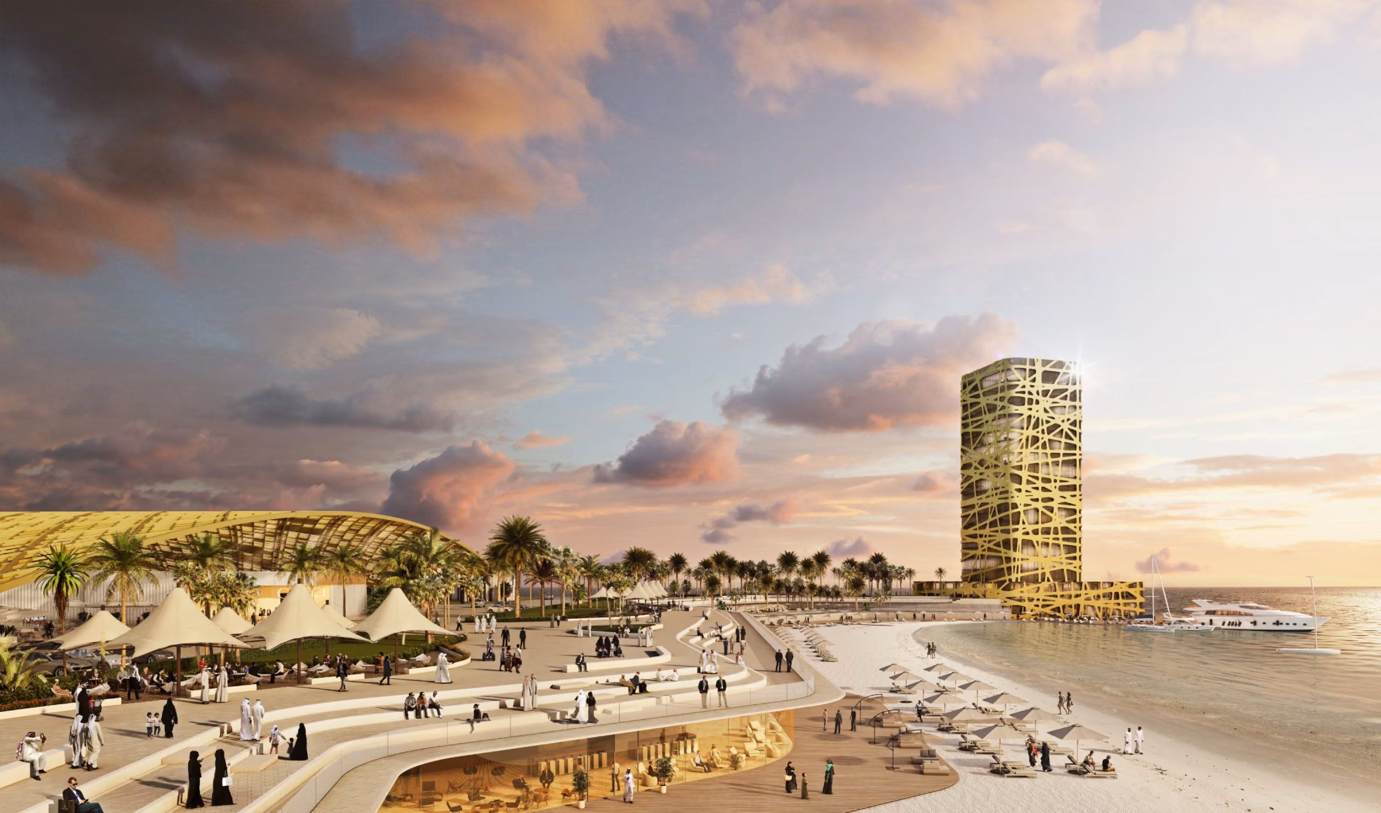 Paseo marítimo moderno al atardecer, con una playa de arena blanca, sombrillas alineadas junto al mar y una torre dorada de diseño orgánico al fondo. A la izquierda, un edificio de techo curvo cubierto de palmas y zonas ajardinadas. Varias personas caminan y descansan en el paseo, disfrutando del entorno costero y la arquitectura contemporánea.