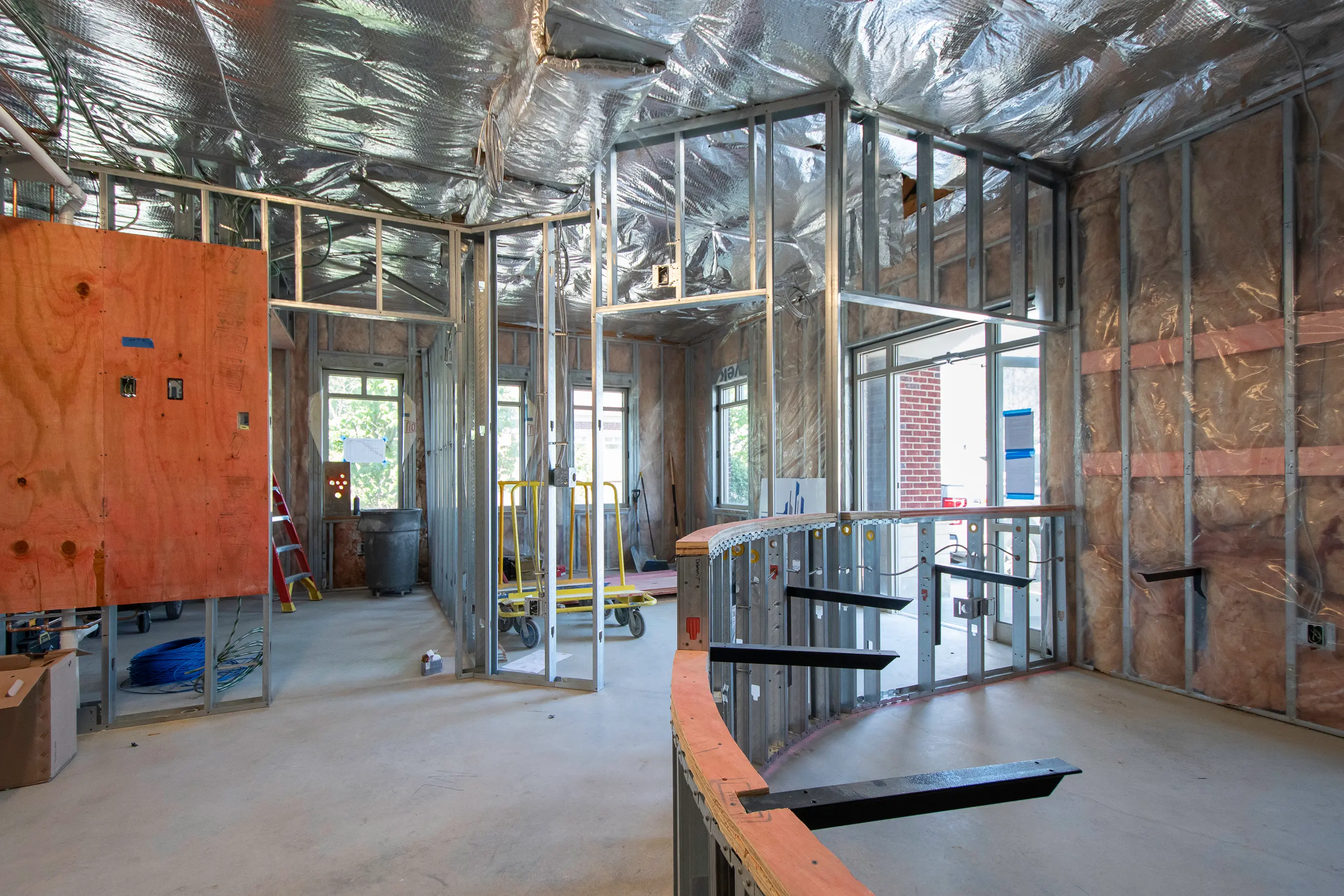 Reception desk under construction at Parker Periodontics, highlighting framing and installation by Perry Contracting.
