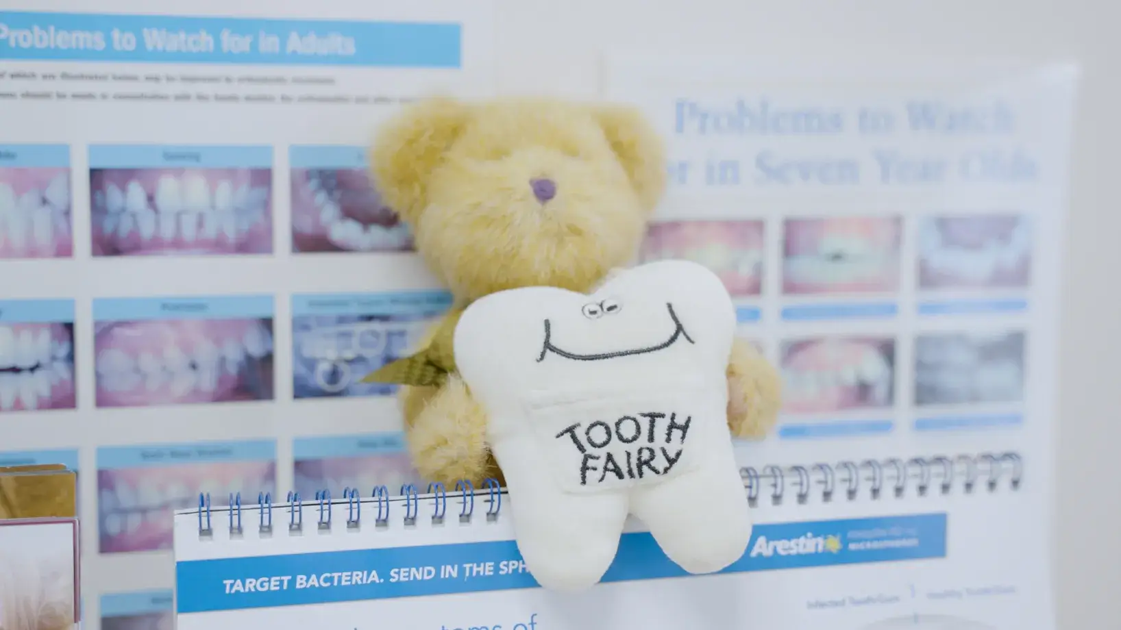Dental X-ray machine positioned in a narrow room, ready for patient use.