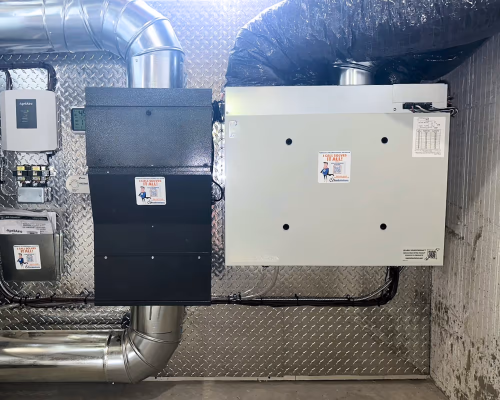 A photo of a Prosolutions' installed HRV system and air filtration combination.
