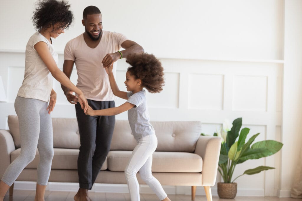 Happy family follows house heating tips to stay warm in the winter in Edmonton
