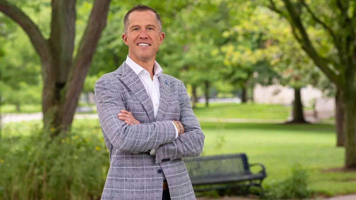 A portrait of Nathan Christensen standing on ISU's campus