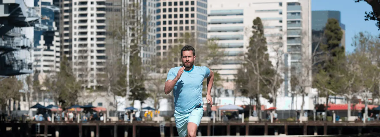 A man runs fast for exercise and has an active, athletic lifestyle thanks to the best sports medicine and orthopedic doctor in San Diego