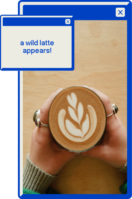 A photo of an latte with beautiful latte art, on a table, in the sunlight.