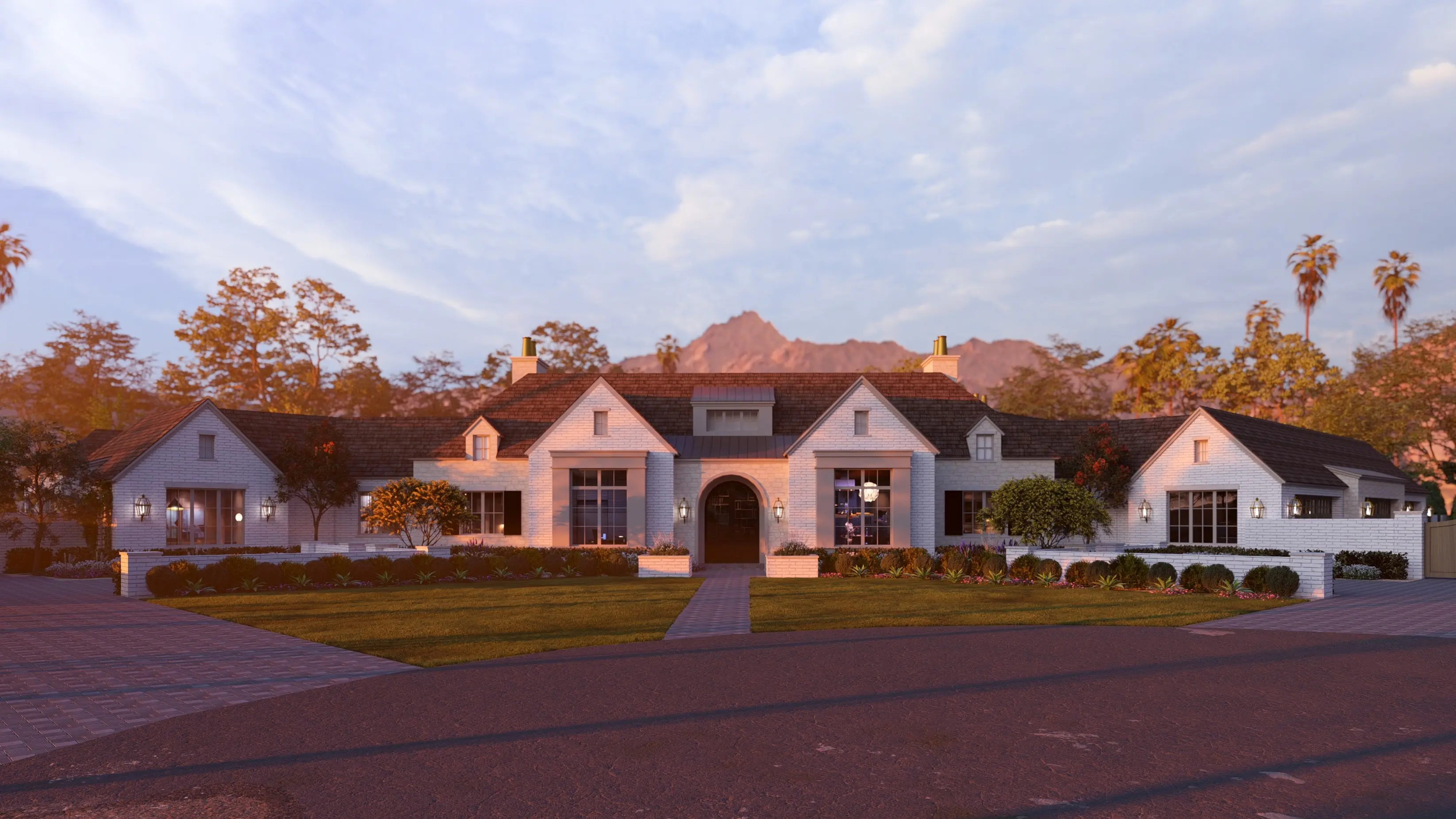 Modern large beige house with arched windows, tiled roof, front yard with lights and flowers, at sunset.