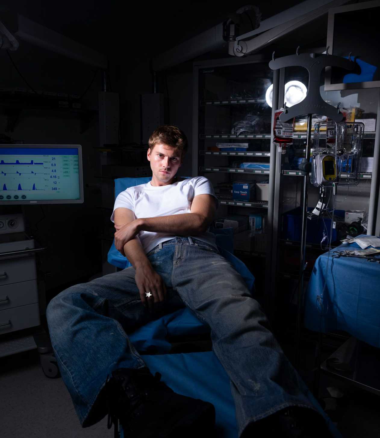 Ruel sitting back in hospital chair
