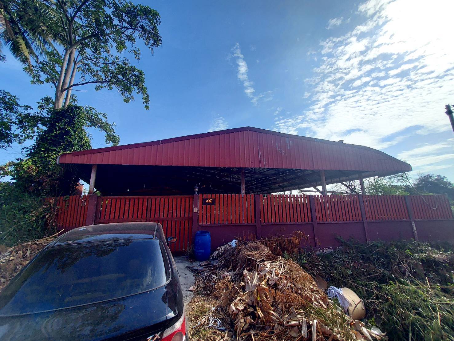 A large house surrounding trees